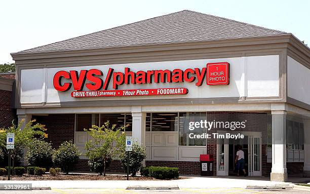 Woman walks into a CVS store June 23, 2005 in Mount Prospect, Illinois. CVS has introduced their new CVS One-Time-Use Video Camcorder, the world's...
