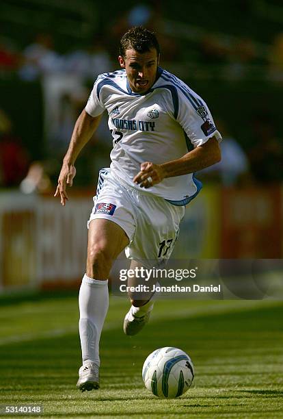 Chris Klein of the Kansas City Wizards runs the ball through midfield against the Chicago Fire on June 18, 2005 at Soldier Field in Chicago,...