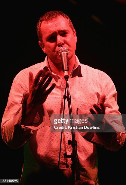 Actor Alan Fletcher performs at the Neighbours Rocks for AIDS Fundraiser June 23, 2005 at the Palace in Melbourne, Australia.