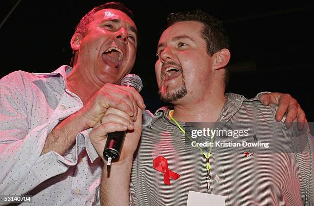 Actors Alan Fletcher and Ryan Moloney perform at the Neighbours Rocks for AIDS Fundraiser June 23, 2005 at the Palace in Melbourne, Australia.