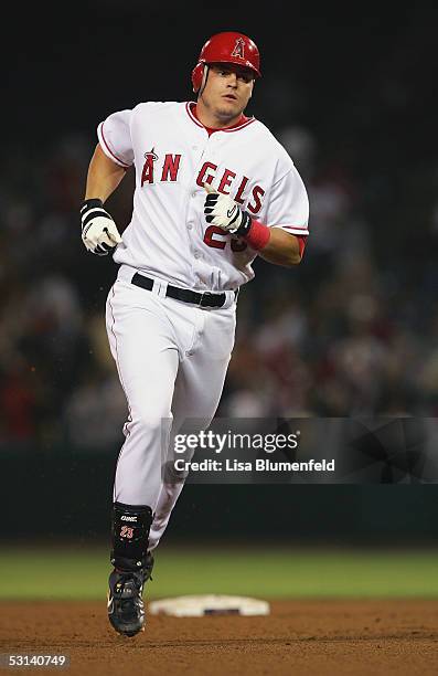 Dallas McPherson of the Los Angeles Angels of Anaheim rounds the bases after hitting a two-run home run in the seventh inning against the Chicago...