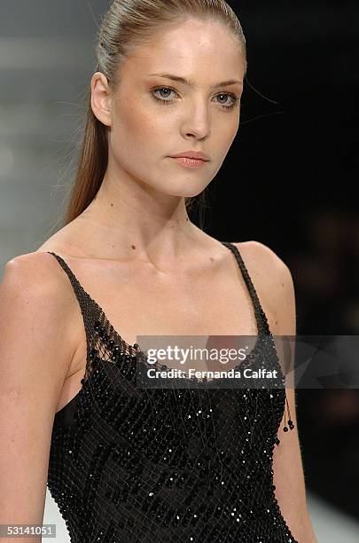 Model walks down the runway during the Marcia Ganem Summer 2006 fashion show at Rio's Modern Art Museum during Rio Fashion Week on June 18, 2005 in...
