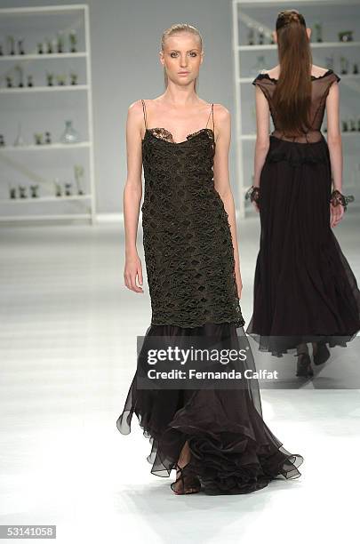 Model walks down the runway during the Marcia Ganem Summer 2006 fashion show at Rio's Modern Art Museum during Rio Fashion Week on June 18, 2005 in...