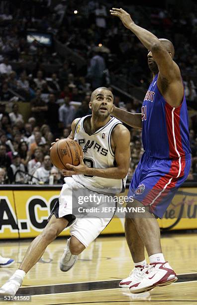 Frenchman Tony Parker of the San Antonio Spurs goes around Elden Campbell of the Detroit Pistons during the first half of game seven of the NBA...