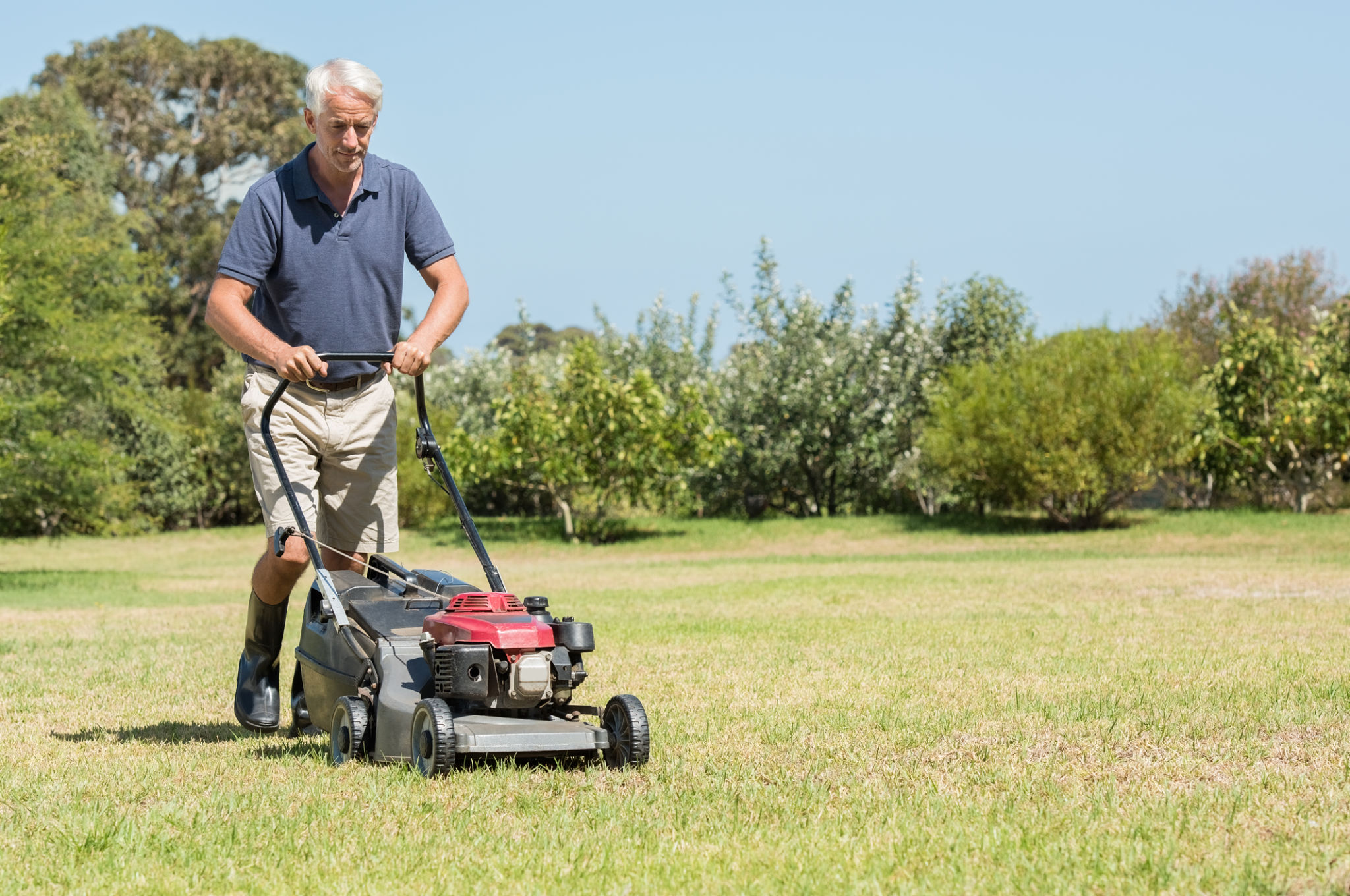 man mowing lawn