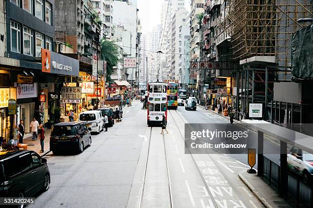 tram, greetings road west, hong kong - hong kong island stock pictures, royalty-free photos & images