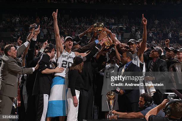 The San Antonio Spurs celebrate winning the 2005 NBA Championship with the Larry O'Brien trophy following their 81-74 win against the Detroit Pistons...