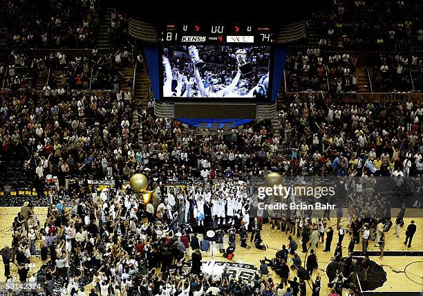 An image of Tim Duncan of the San Antonio Spurs on the big screen over the court is projected as the Spurs celebrate their victory over the Detroit...