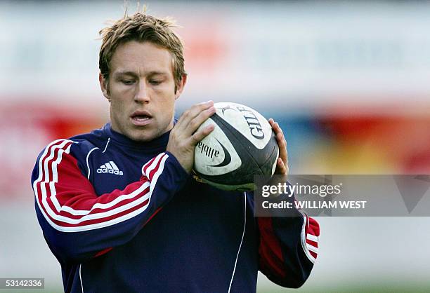 British and Irish Lions flyhalf Jonny Wilkinson looks deep in thought as he catches a ball during the team's final training run, in Christchurch 24...