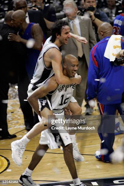 Manu Ginobili and Bruce Bowen of the 2005 NBA Champion San Antonio Spurs celebrate after winning Game seven of the 2005 NBA Finals 81-74 against the...