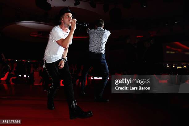 Thomas Muller dances as Music band, OneRepublic performs at the FC Bayern Muenchen Bundesliga Champions Dinner at the Postpalast on May 14, 2016 in...