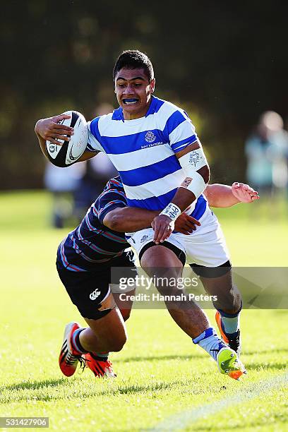 Wesley Tameifuna of St Kentigern makes a break during the Auckland Schoolboy rugby match between Sacred Heart College and St. Kentigern College at...