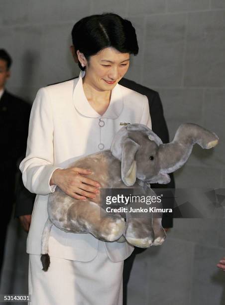 Princess Kiko, holding a stuffed toy elephant, as she arrives at a cinema at Roppongi Hills to watch the film "Shining Boy And Little Randy" with...