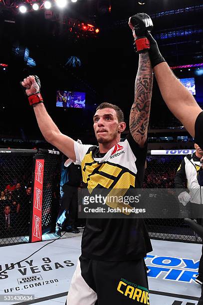 Renato Moicano of Brazil celebrates after defeating Zubaira Tukhugov of Russia in their featherweight bout during the UFC 198 event at Arena da...