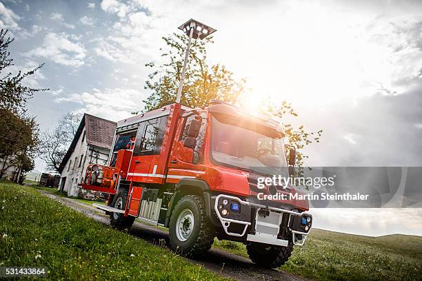 fire truck front view - feuerwehrauto stock-fotos und bilder