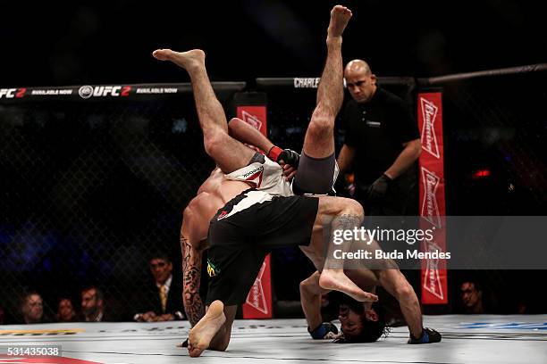 Renato Mocaio of Brazil competes Zubaira Tukhugov of Russia in their featherweight bout during the UFC 198 at Arena da Baixada stadium on May 14,...