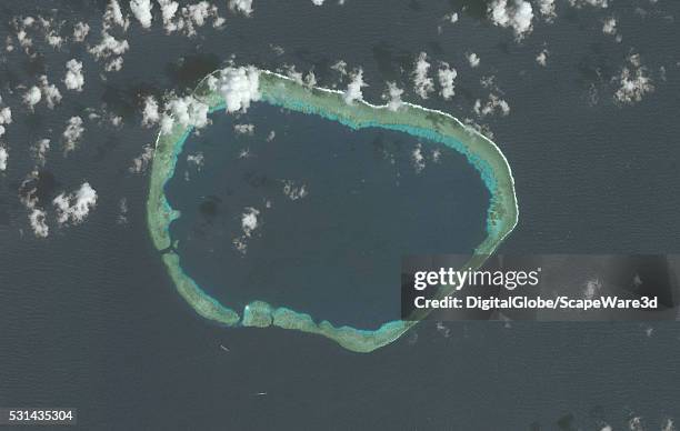 DigitalGlobe via Getty Images imagery from 1 February 2015 shows no construction at Mischief Reef.