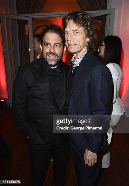 Director Brett Ratner and musician Mick Jagger attend Vanity Fair and HBO Dinner Celebrating the Cannes Film Festival at Hotel du Cap-Eden-Roc on May...