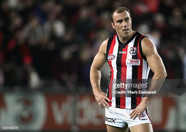 Fraser Gehrig for the Saints watches the Bombers celebrate after winning the AFL Round 13 match between the Essendon Bombers and the St Kilda Saints...