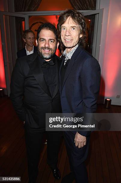 Director Brett Ratner and musician Mick Jagger attend Vanity Fair and HBO Dinner Celebrating the Cannes Film Festival at Hotel du Cap-Eden-Roc on May...