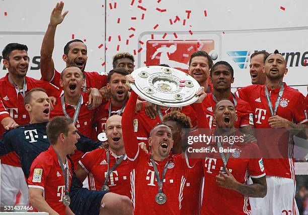 Franck Ribery and the team of Bayern Muenchen celebrates with the German Championship trophy after the Bundesliga match between FC Bayern Muenchen...