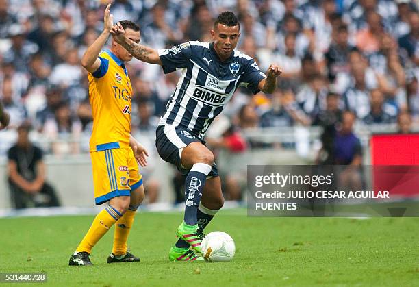 Edwin Cardona of Monterrey vies for the ball with Israel Jimenez of Tigres during the second leg of the quarterfinal of the Mexican Clausura 2016...