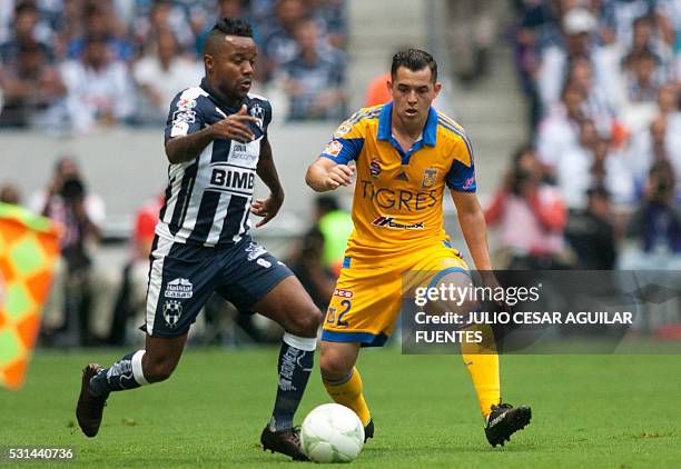 Dorlan Pabon of Monterrey vies for the ball with Israel Jimenez of Tigres during the second leg of the quarterfinal of the Mexican Clausura 2016...