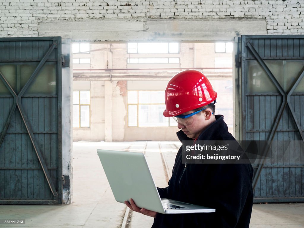 Asian engineer working in factory