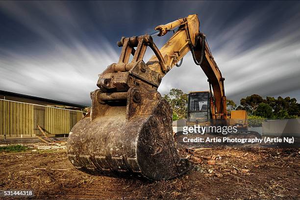 the demolition excavator - demolishing stock pictures, royalty-free photos & images
