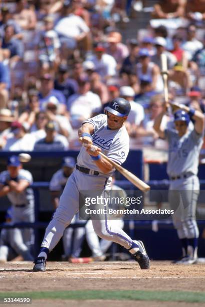 George Brett of the Kansas City Royals swings at a pitch during a game against the California Angels at Angels stadium on August 5, 1993 in Anaheim,...