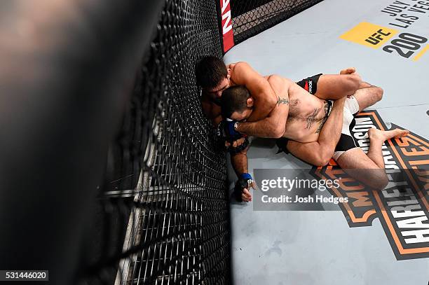 Demian Maia of Brazil controls the body of Matt Brown in their welterweight bout during the UFC 198 event at Arena da Baixada stadium on May 14, 2016...