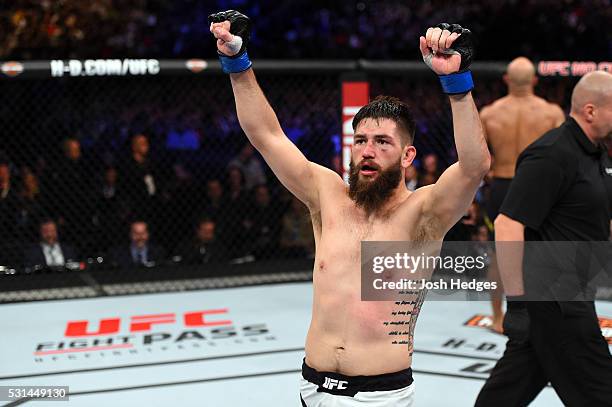 Bryan Barberena celebrates after defeating Warlley Alves of Brazil in their middleweight bout during the UFC 198 event at Arena da Baixada stadium on...