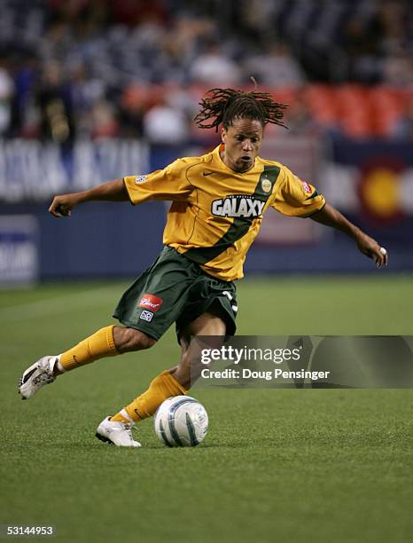 Midfielder Cobi Jones of the Los Angeles Galaxy dribbles the ball against the Colorado Rapids during the game at Invesco Field at Mile High Stadium...