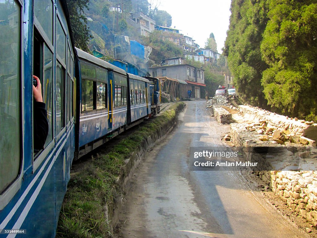 Toy train (himalayan railway) crossing rural areas