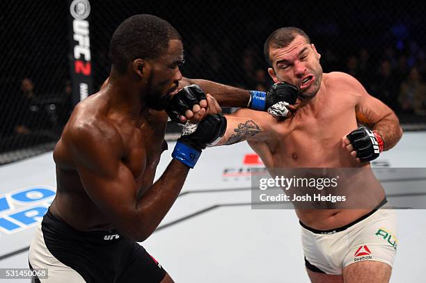 Corey Anderson and Mauricio 'Shogun' Rua of Brazil exchange punches in their light heavyweight bout during the UFC 198 event at Arena da Baixada...
