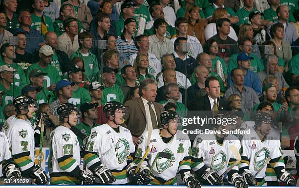 President and Head Coach Dale Hunter, Vice President and General Manager Mark Hunter of the London Knights and members of the London Knights look on...