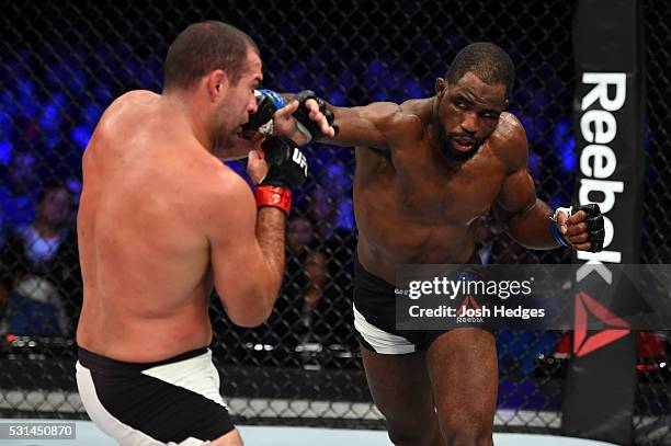 Corey Anderson punches Mauricio 'Shogun' Rua of Brazil in their light heavyweight bout during the UFC 198 event at Arena da Baixada stadium on May...
