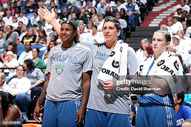 Jia Perkins, Janel McCarville and Lindsay Whalen of the Minnesota Lynx looks on during the game against the Phoenix Mercury during the WNBA game on...