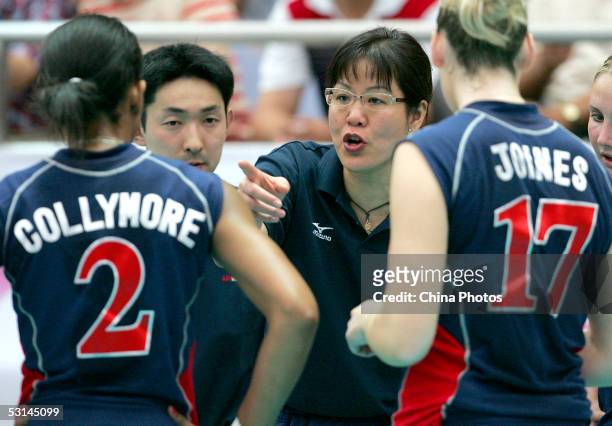 Lang Ping, former coach of Chinese Women's Volleyball Team and now head coach of the United States Women's Volleyball Team, instructs players during...
