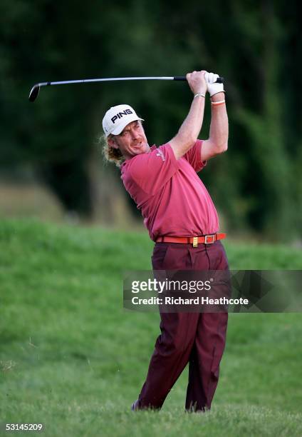 Miguel Angel Jimenez of Spain plays from the rough on the 14th during the second round of the Open de France at Le Golf National on June 24, 2005 in...