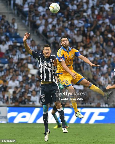 Cesar Montes of Monterrey fights for the ball with Andre Gignac of Tigres during the quarter finals second leg match between Monterrey and Tigres...