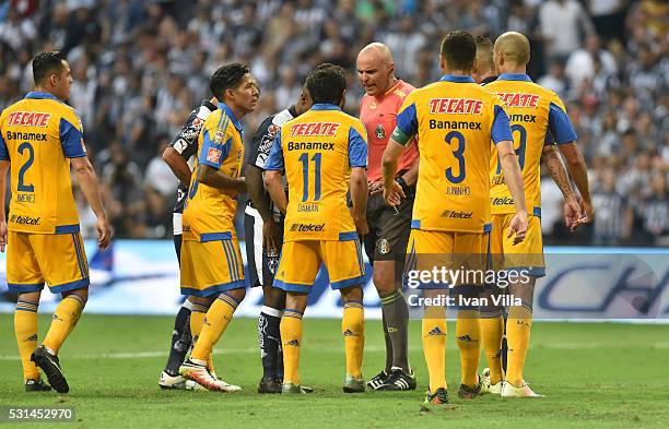 Players of Tigres appeal to referee Francisco Chacon during the quarter finals second leg match between Monterrey and Tigres UANL as part of the...