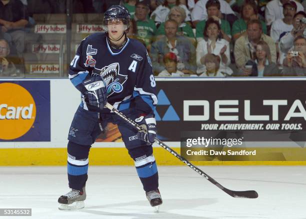 Sidney Crosby of the Rimouski Oceanic eyes the play during finals of the Mastercard Memorial Cup Tournament against the London Knights at the John...