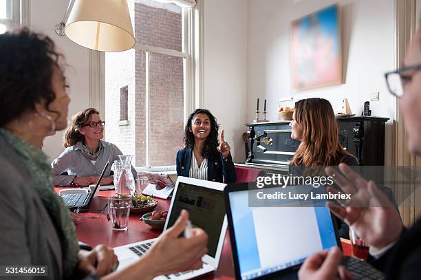 group of business women at a meeting - amsterdam business stock pictures, royalty-free photos & images