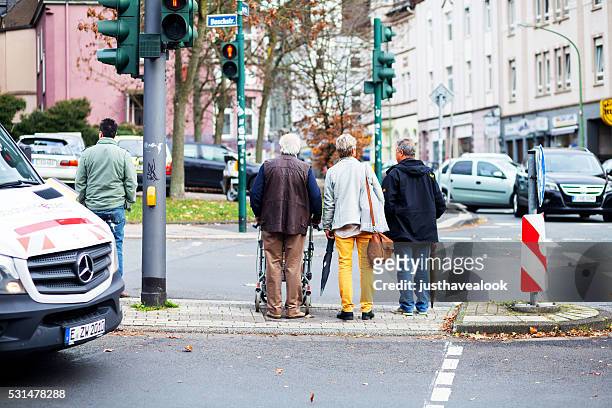seniors waiting for green - senior essen stock pictures, royalty-free photos & images