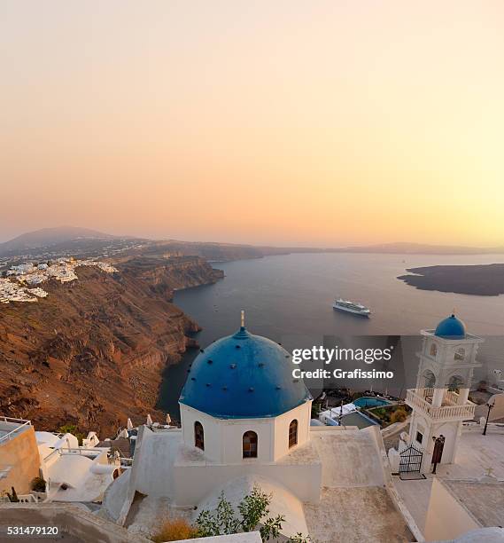 santorini bell tower and blue domes in oia on greece - santorin stock pictures, royalty-free photos & images