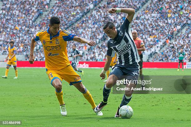 Hugo Ayala of Tigres fights for the ball with Rogelio Funes Mori of Monterrey during the quarter finals second leg match between Monterrey and Tigres...