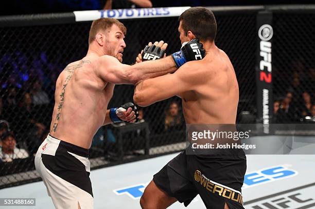 Stipe Miocic punches Fabricio Werdum of Brazil in their UFC heavyweight championship bout during the UFC 198 event at Arena da Baixada stadium on May...