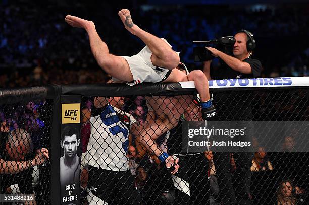 Stipe Miocic celebrates after defeating Fabricio Werdum of Brazil by KO in their UFC heavyweight championship bout during the UFC 198 event at Arena...