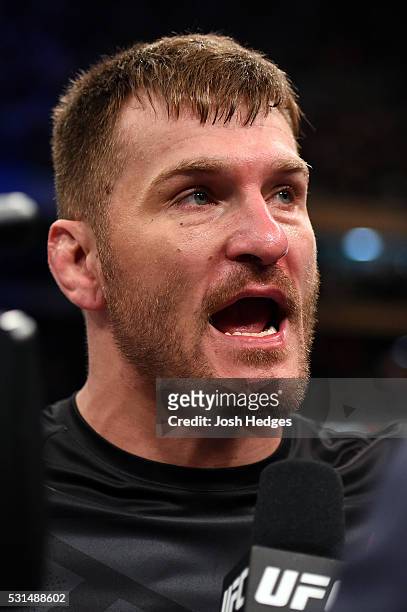 Stipe Miocic is interviewed after defeating Fabricio Werdum of Brazil by KO in their UFC heavyweight championship bout during the UFC 198 event at...